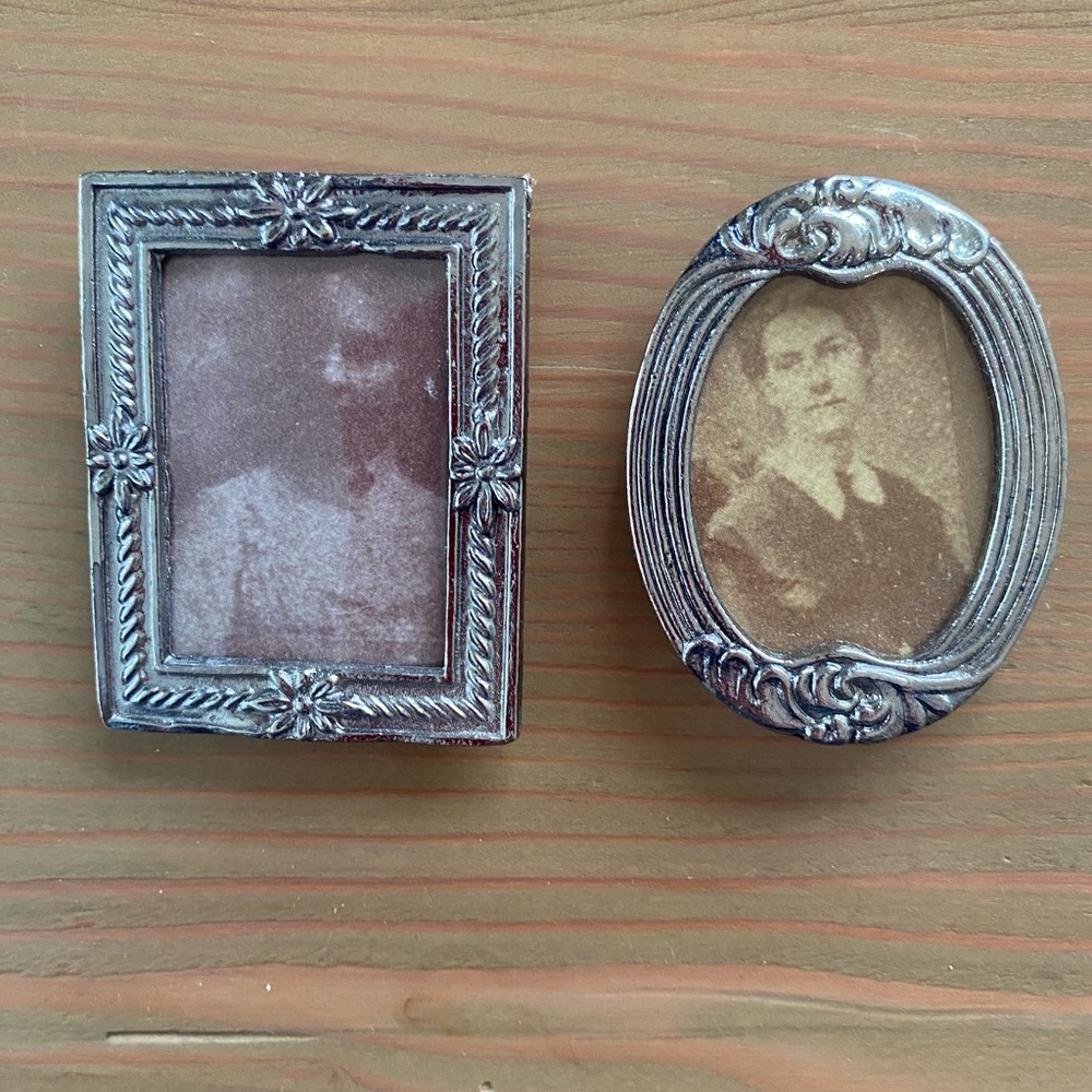 Two small metal picture frames